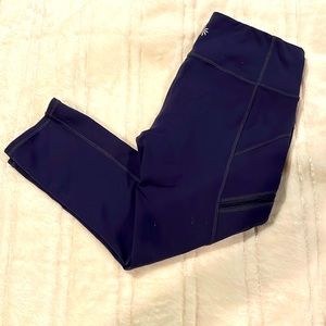 Athleta navy blue side zip pocket crop leggings.